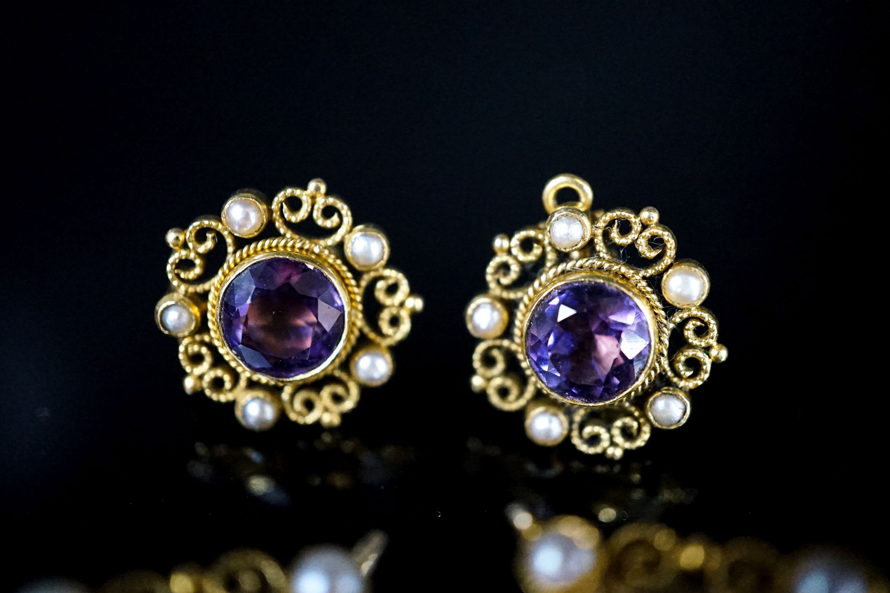 A pair of yellow metal and split pearl mounted pear cut amethyst pendants, 35mm and a pair of similar ear studs, gross weight 23.9 grams.